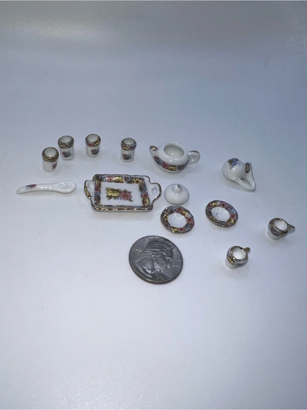 Miniature Porcelain Tea Set with Floral and Gold Trim